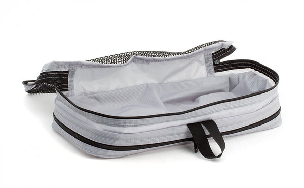 An empty and open Northwest Sky (light grey) Aether Small Aeronaut 45 Packing Cube mesh side up.